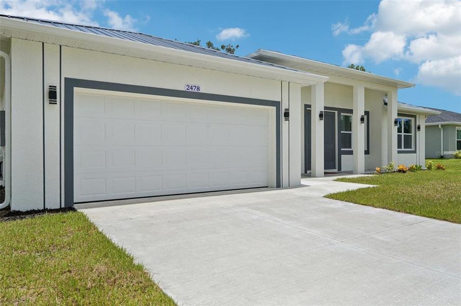 Front exterior of a new home in , North Port, FL, highlighting curb appeal (Image 19).