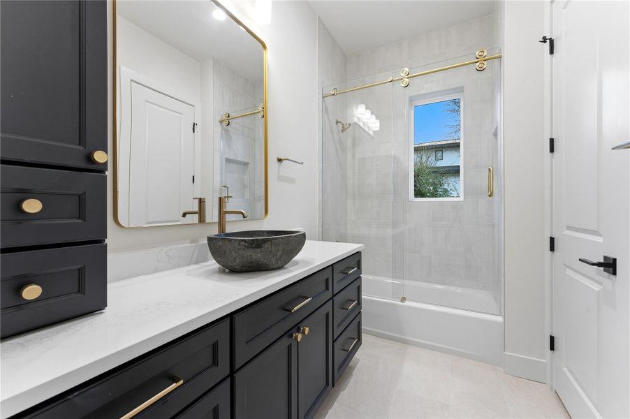 Full bath with vanity and shower / bath combination with glass door