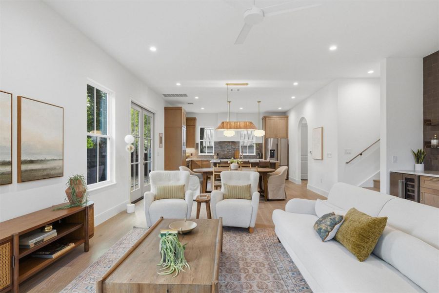An open-concept living space integrates a well-appointed kitchen and dining area, fostering seamless entertaining.