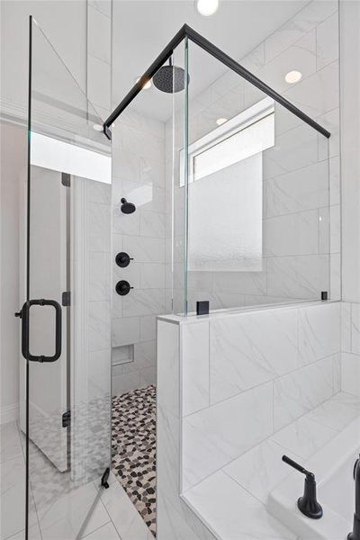 Full bathroom featuring a shower stall