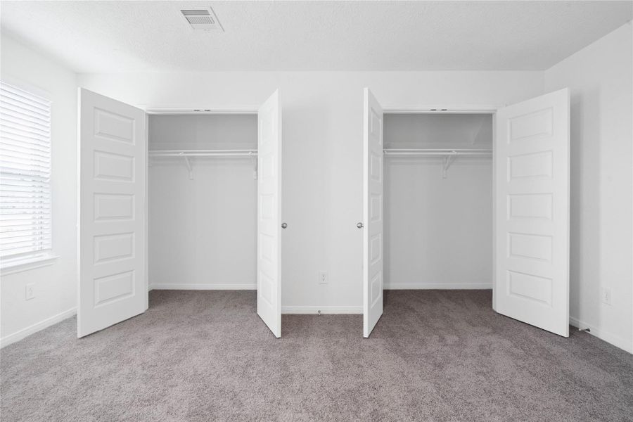 Double the storage! Dual primary closets with built-in hanging rods and upper shelving keep organization simple.