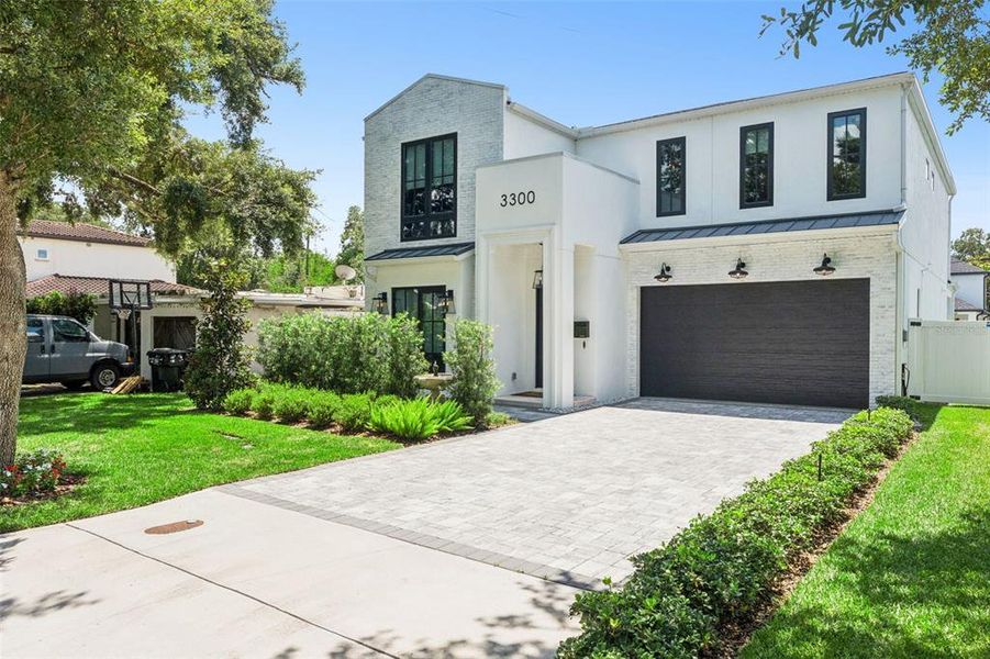 Front exterior of a new home in , Orlando, FL, highlighting curb appeal (Image 26).