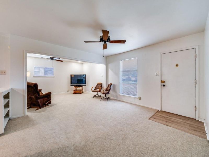 Sitting room featuring a ceiling fan and light carpet Sitting room featuring a ceiling fan and light carpet