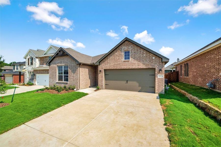 Front exterior of a new home in Liberty Pointe, Gainesville, TX, highlighting curb appeal (Image 20). Front exterior of a new home in Liberty Pointe, Gainesville, TX, highlighting curb appeal (Image 20).