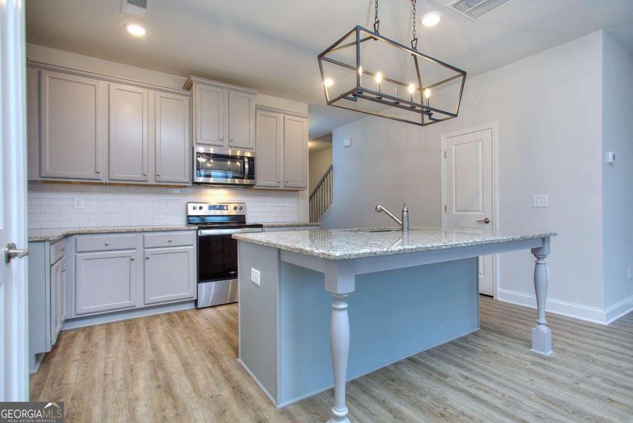 Furnished interior view inside a new home in Chimney Oaks Townhomes, Homer (Image 6).