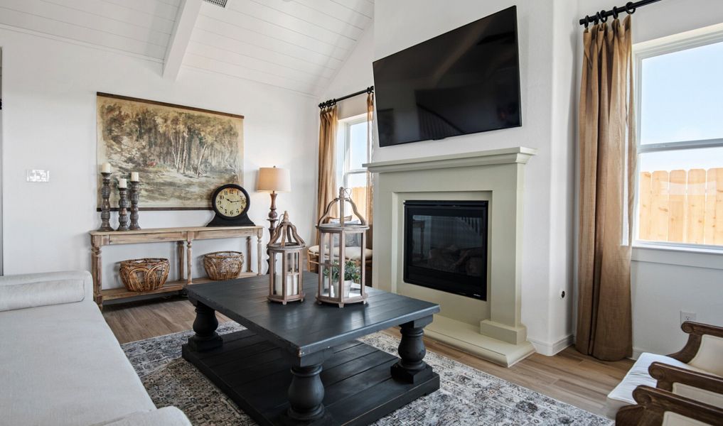 Great room with vaulted ceiling and fireplace Great room with vaulted ceiling and fireplace