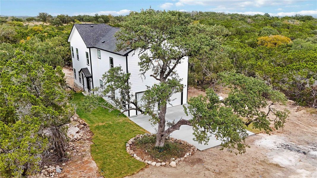 Front exterior of a new home in , Wimberley, TX, highlighting curb appeal (Image 30).