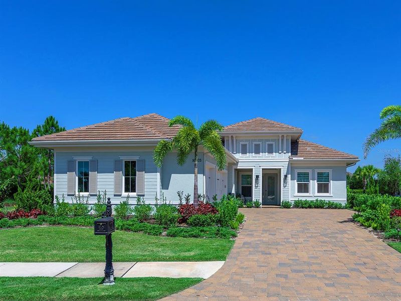 Front exterior of a new home in , Lakewood Ranch, FL, highlighting curb appeal (Image 22).