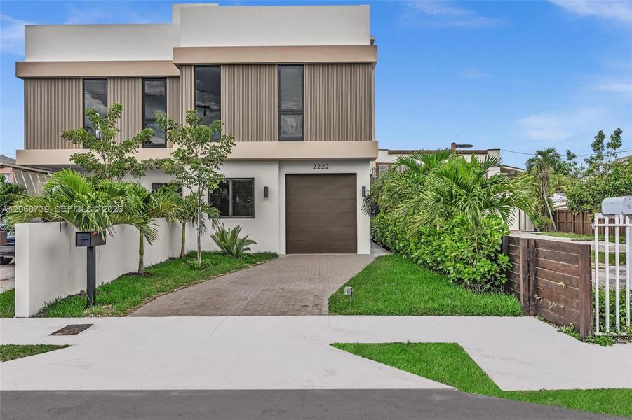Front exterior of a new home in , Miami, FL, highlighting curb appeal (Image 27).