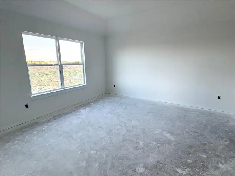 Unfurnished room with unfinished concrete floors Unfurnished room with unfinished concrete floors