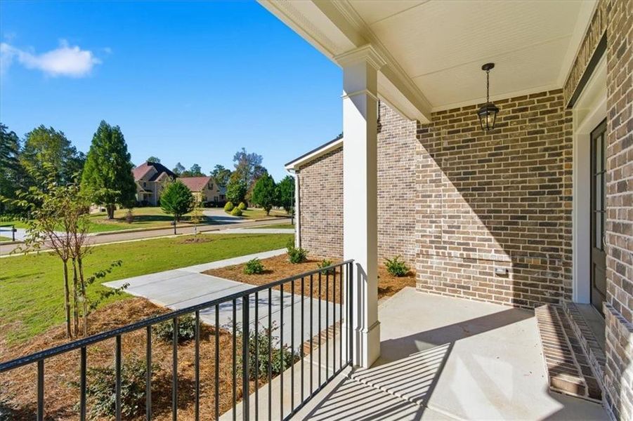 Exterior details and patio area of a home in The Estates at Hurricane Pointe, Douglasville (Image 29).