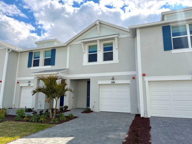 Front exterior of a new home in Tidewater, Fort Pierce, FL, highlighting curb appeal (Image 10). Front exterior of a new home in Tidewater, Fort Pierce, FL, highlighting curb appeal (Image 10).