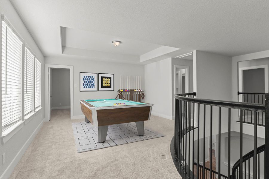 The upstairs game room offers endless possibilities! Bright and open with plush carpet flooring, this versatile area can be used for movie nights, hobbies, or as a relaxing retreat for family and friends. *Photo Staged* The upstairs game room offers endless possibilities! Bright and open with plush carpet flooring, this versatile area can be used for movie nights, hobbies, or as a relaxing retreat for family and friends. *Photo Staged*