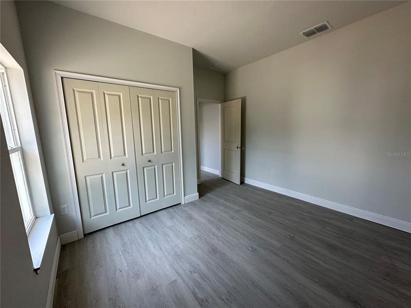 Bedroom 2 with window facing the side yard