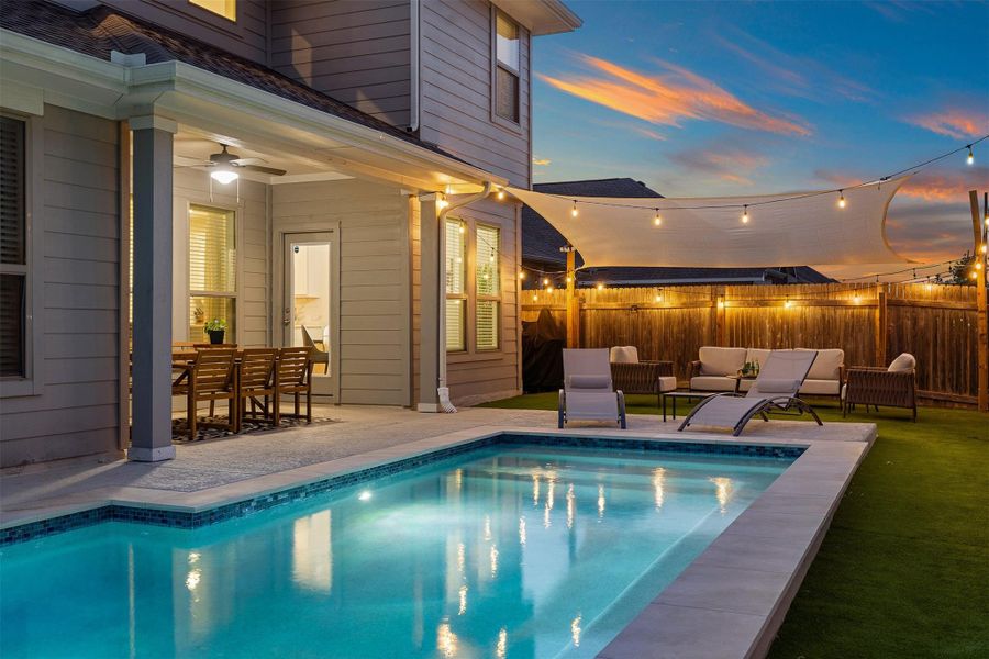 The saltwater pool added in 2025 brings a fresh, modern feel to the entire backyard