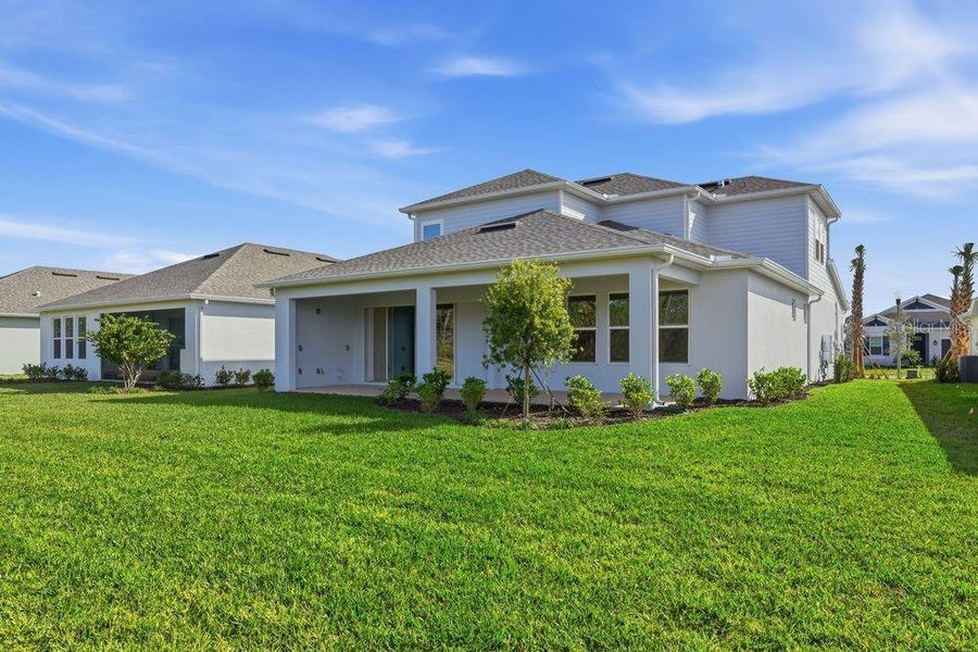 Exterior details and patio area of a home in Ardisia Park, New Smyrna Beach (Image 25).