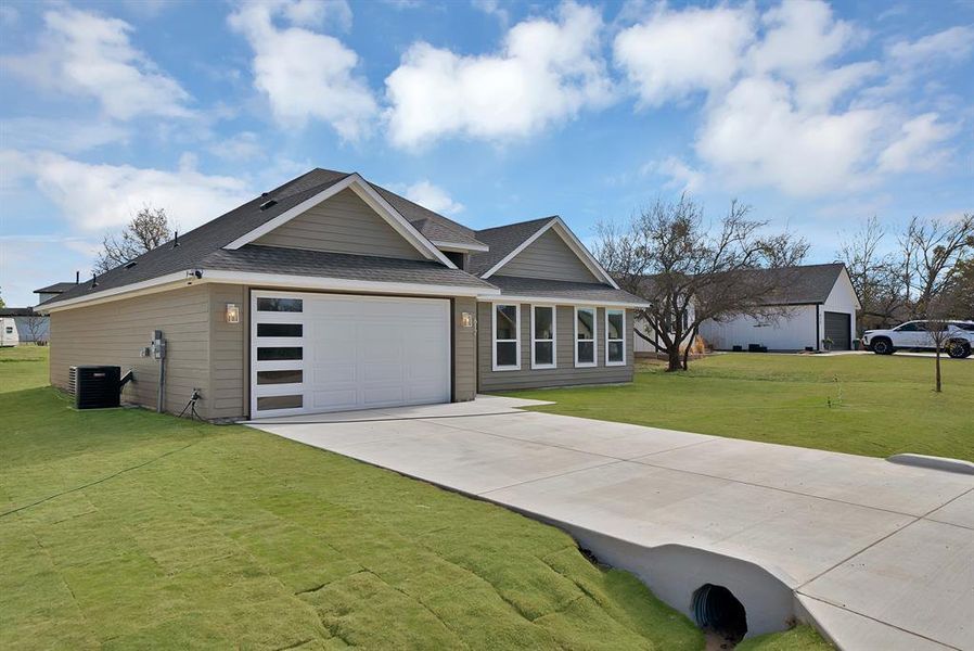 Front exterior of a new home in , Runaway Bay, TX, highlighting curb appeal (Image 1). Front exterior of a new home in , Runaway Bay, TX, highlighting curb appeal (Image 1).