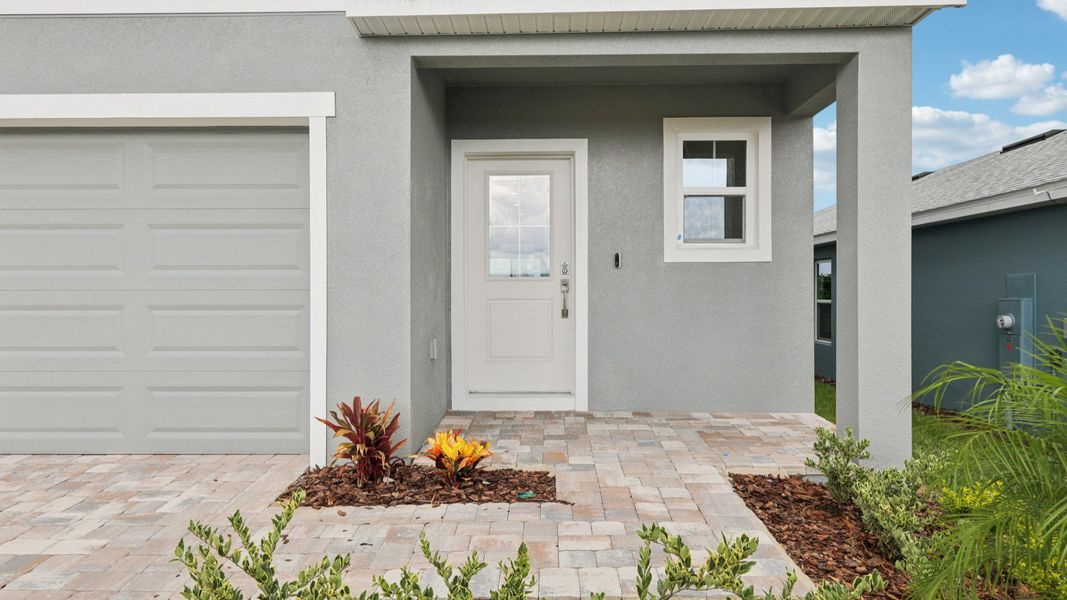 Representative exterior photo of a completed home built from the Naples by DRB Homes in Hamilton Bluff, Haines City, FL (Image 23). Representative exterior photo of a completed home built from the Naples by DRB Homes in Hamilton Bluff, Haines City, FL (Image 23).