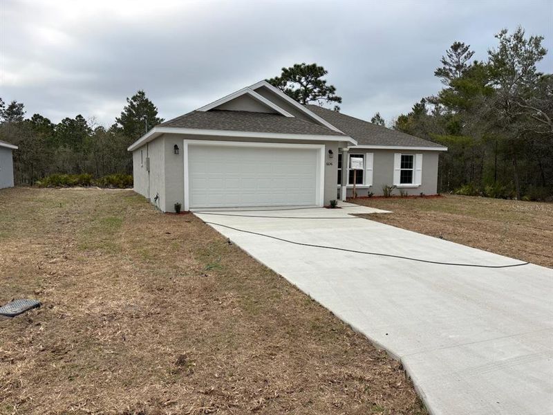 Front exterior of a new home in , Dunnellon, FL, highlighting curb appeal (Image 2). Front exterior of a new home in , Dunnellon, FL, highlighting curb appeal (Image 2).