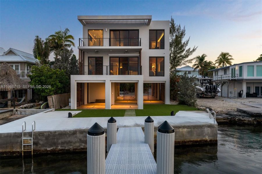 Front exterior of a new home in , Key Largo, FL, highlighting curb appeal (Image 24). Front exterior of a new home in , Key Largo, FL, highlighting curb appeal (Image 24).