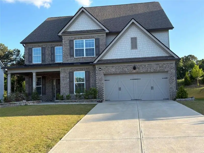 Front exterior of a new home in Briarwood, Cumming, GA, highlighting curb appeal (Image 2). Front exterior of a new home in Briarwood, Cumming, GA, highlighting curb appeal (Image 2).