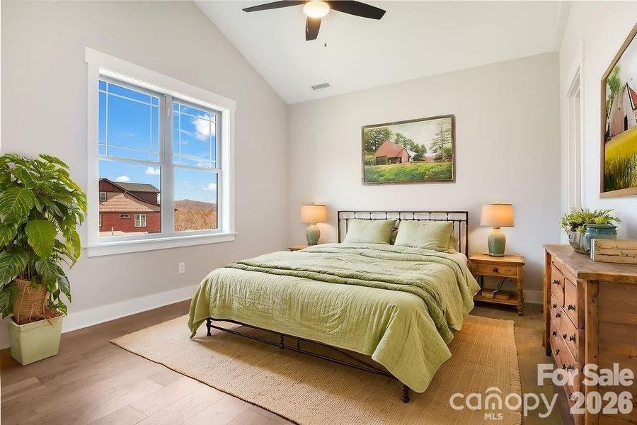 Secondary bedroom on Main level. Vaulted ceiling with ceiling fan. Virtually staged. Similar Model Home. Secondary bedroom on Main level. Vaulted ceiling with ceiling fan. Virtually staged. Similar Model Home.