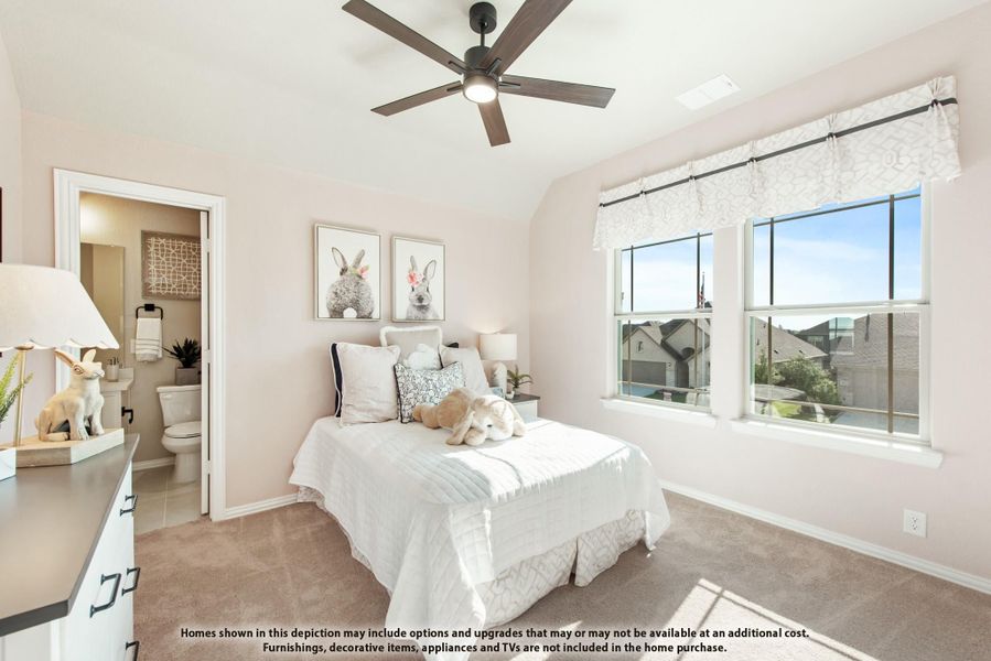 Children's bedroom with vaulted ceiling, ceiling fan, carpet, and ensuite bathroom access Children's bedroom with vaulted ceiling, ceiling fan, carpet, and ensuite bathroom access