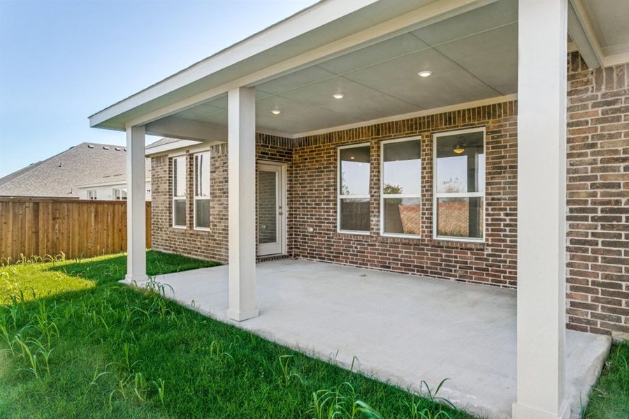 Exterior details and patio area of a home in The Preserve Estates, Justin (Image 3).