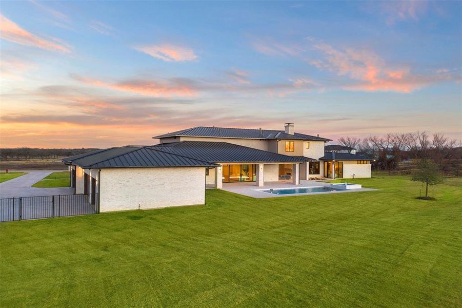 Another view of backyard and garage area.