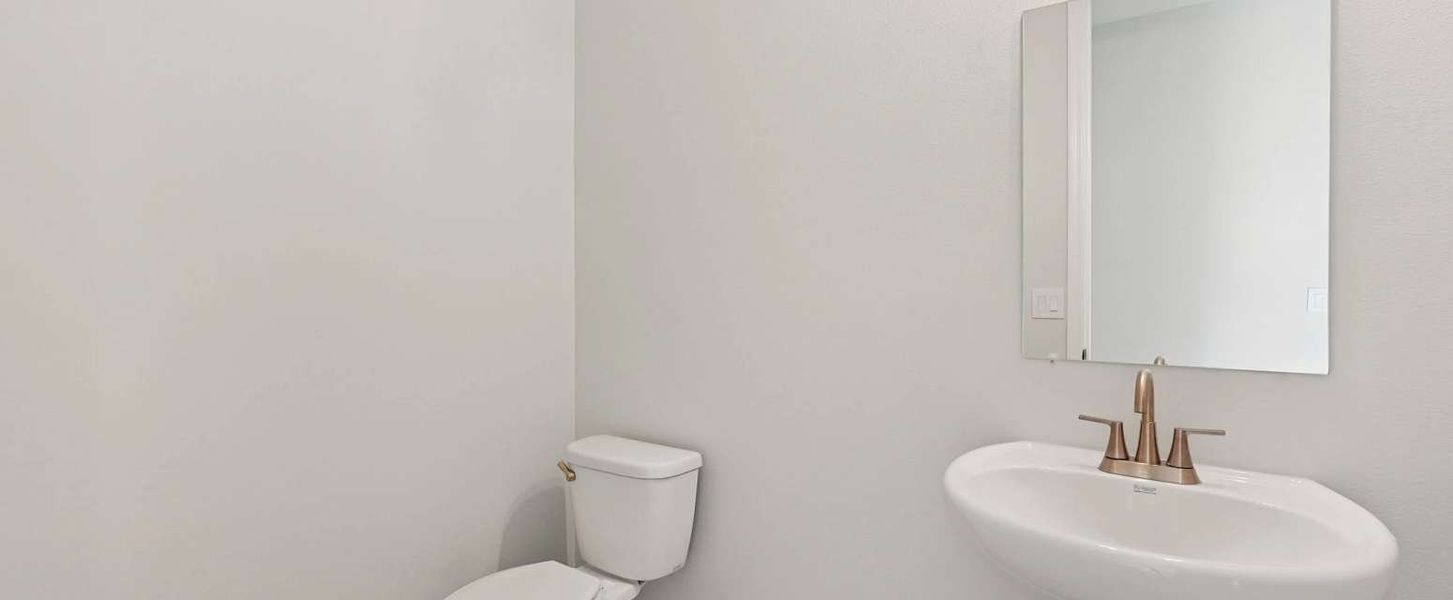 Half bathroom located off the foyer - representative image Half bathroom located off the foyer - representative image