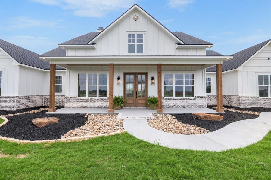 Front exterior of a new home in , Snook, TX, highlighting curb appeal (Image 28).