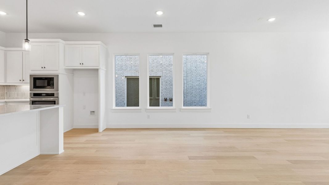 Representative unfurnished interior of a home built from the Chapelle III by Normandy Homes in Rainwater Crossing, Celina (Image 21).