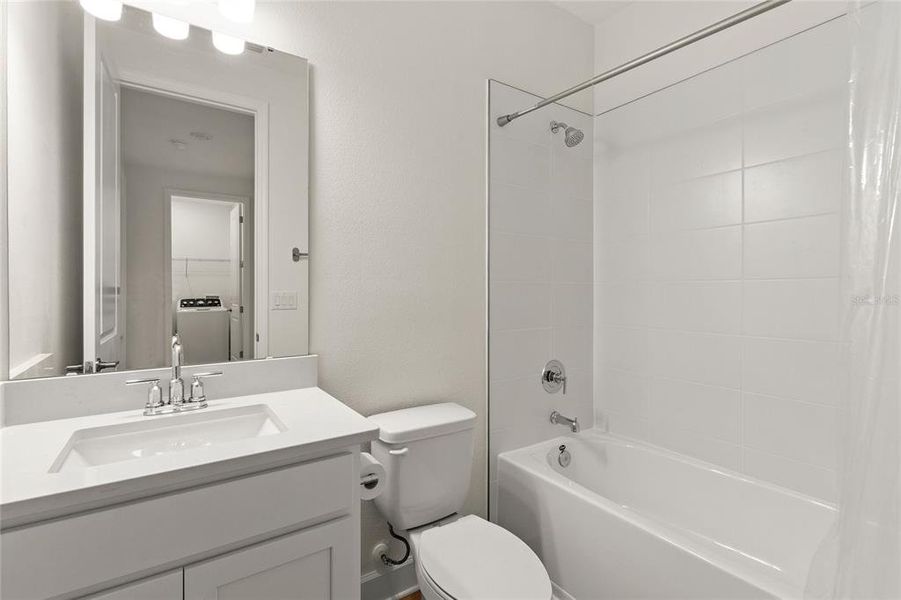 Furnished interior view inside a new home in Harvest at Ovation, Winter Garden (Image 26).