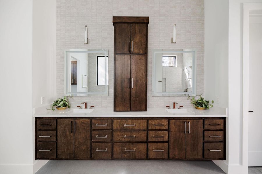 A seamless pairing of stone surfaces, custom cabinetry, and thoughtful lighting. A seamless pairing of stone surfaces, custom cabinetry, and thoughtful lighting.