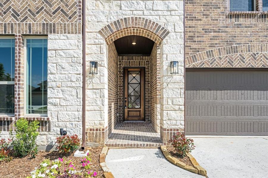 Exterior details and patio area of a home in Woodstone, Providence Village (Image 3).