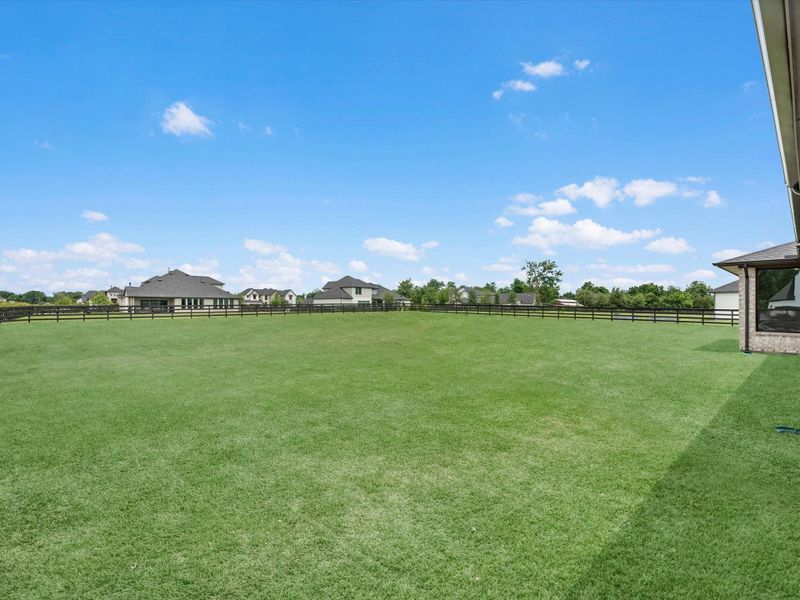 Exterior details and patio area of a home in The Estates at James Lane, Fulshear (Image 20).