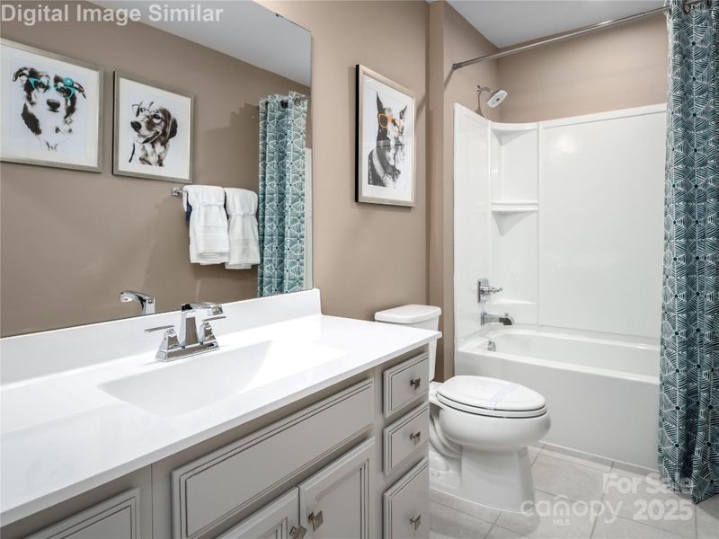 Sharing is caring — this guest bath offers comfort, style, and space for everyone.