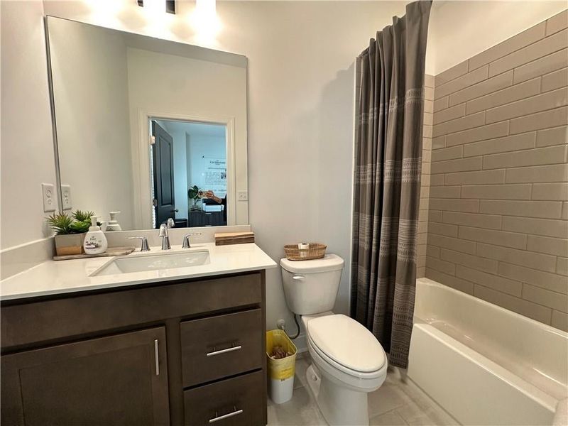 Full bathroom in Guest Bedroom #1 on Terrace Level *Images shown are from a decorated model of the same floor plan. Design selections and color packages will vary by home.*