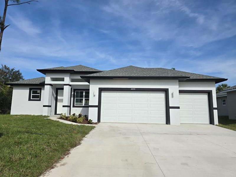 Front exterior of a new home in , Port Charlotte, FL, highlighting curb appeal (Image 1). Front exterior of a new home in , Port Charlotte, FL, highlighting curb appeal (Image 1).