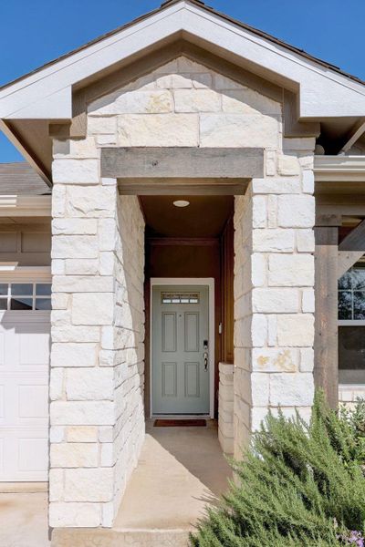Doorway to property with stone siding Doorway to property with stone siding