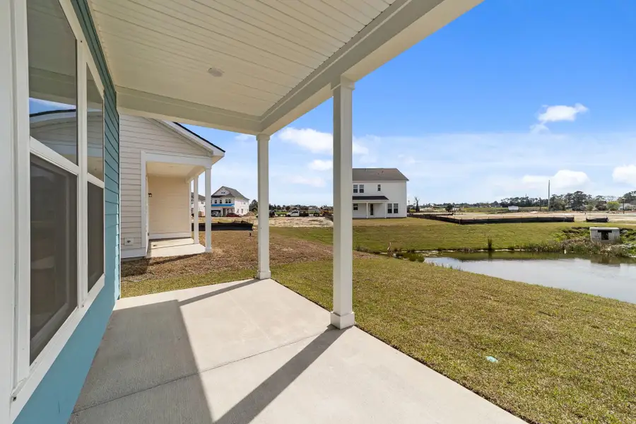 Exterior details and patio area of a home in Blue Heron Retreat, Little River (Image 3).