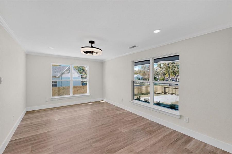 Unfurnished room featuring ornamental molding, light wood finished floors, and recessed lighting