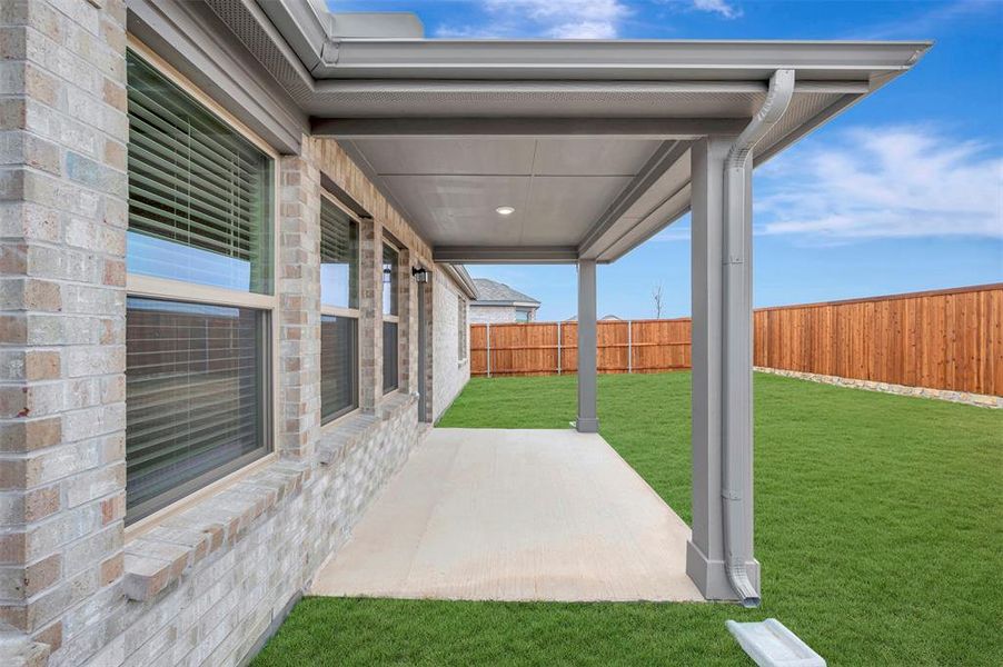 Exterior details and patio area of a home in Mobberly Farms, Pilot Point (Image 4).