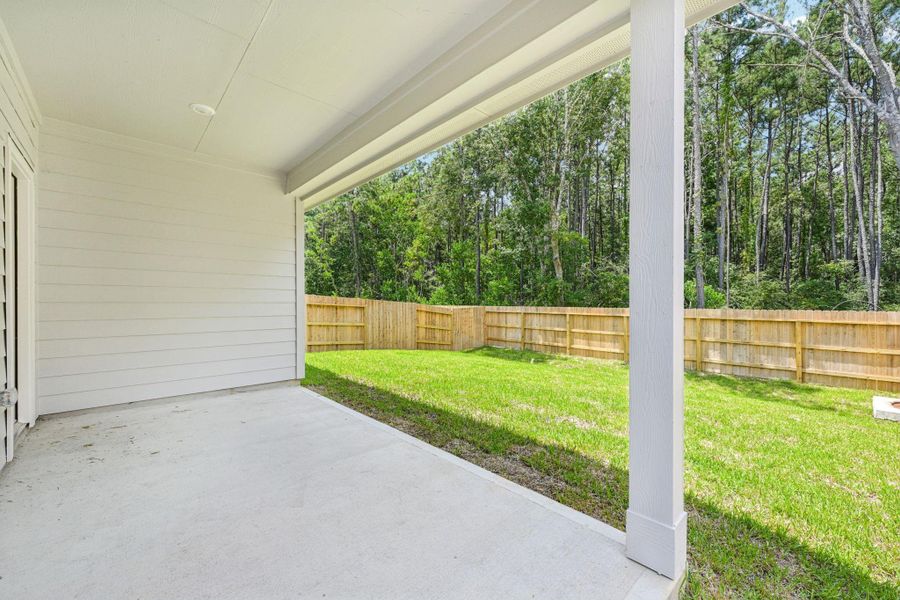 Exterior details and patio area of a home in Landing Meadows - Traditional Series, New Caney (Image 3).