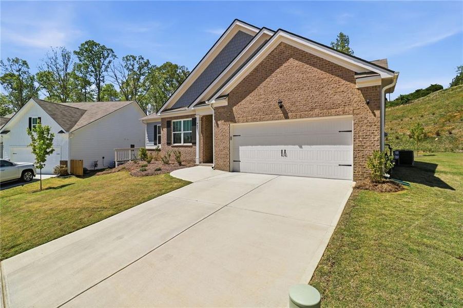 Front exterior of a new home in , Dallas, GA, highlighting curb appeal (Image 25).