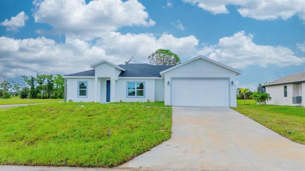Front exterior of a new home in , Placida, FL, highlighting curb appeal (Image 24). Front exterior of a new home in , Placida, FL, highlighting curb appeal (Image 24).