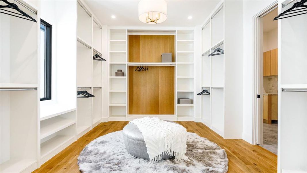 Spacious closet with light wood-type flooring