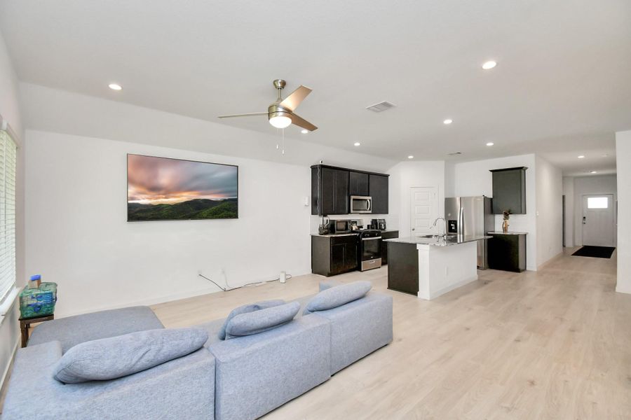 Furnished interior view inside a new home in Post Oak Pointe, Fresno (Image 3).