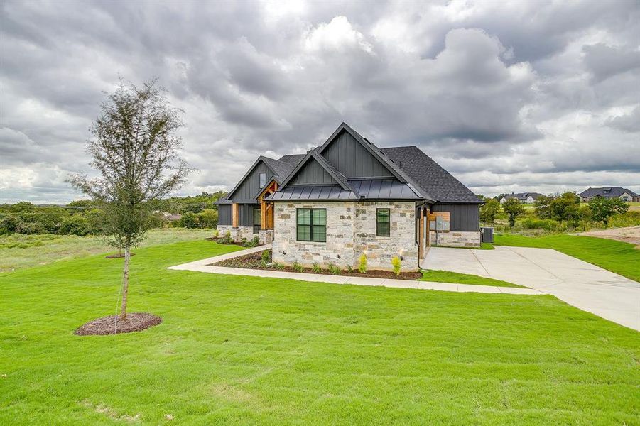 3 car garage has side entrance and epoxy flooring