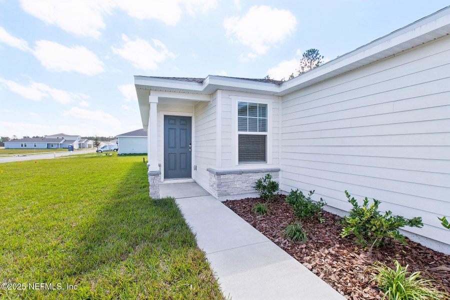 Exterior details and patio area of a home in Flagler Village - Classic Series, Palm Coast (Image 3).
